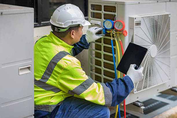 Professional Heat Pump Repair technician working in Fairfax, MO